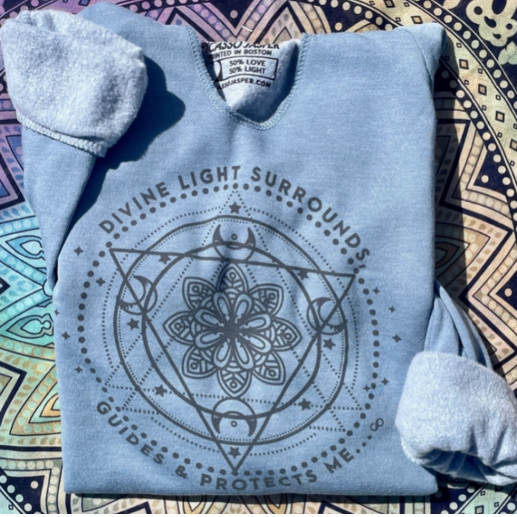 "Divine Light Surrounds, Guides, & Protects Me" - V-Notch Fleece Hoodie. Shown folded.