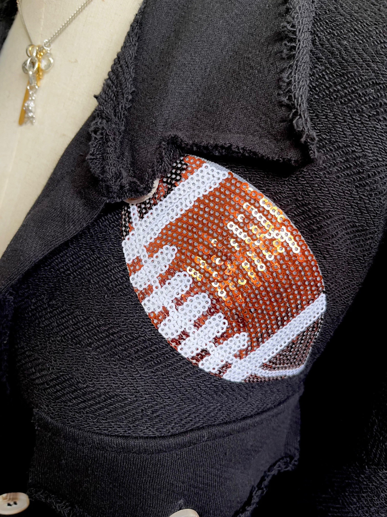 Sequined Football Ladies Oversized Shacket with Patch Pockets Front , Very Close Up of Football Patch and Necklace