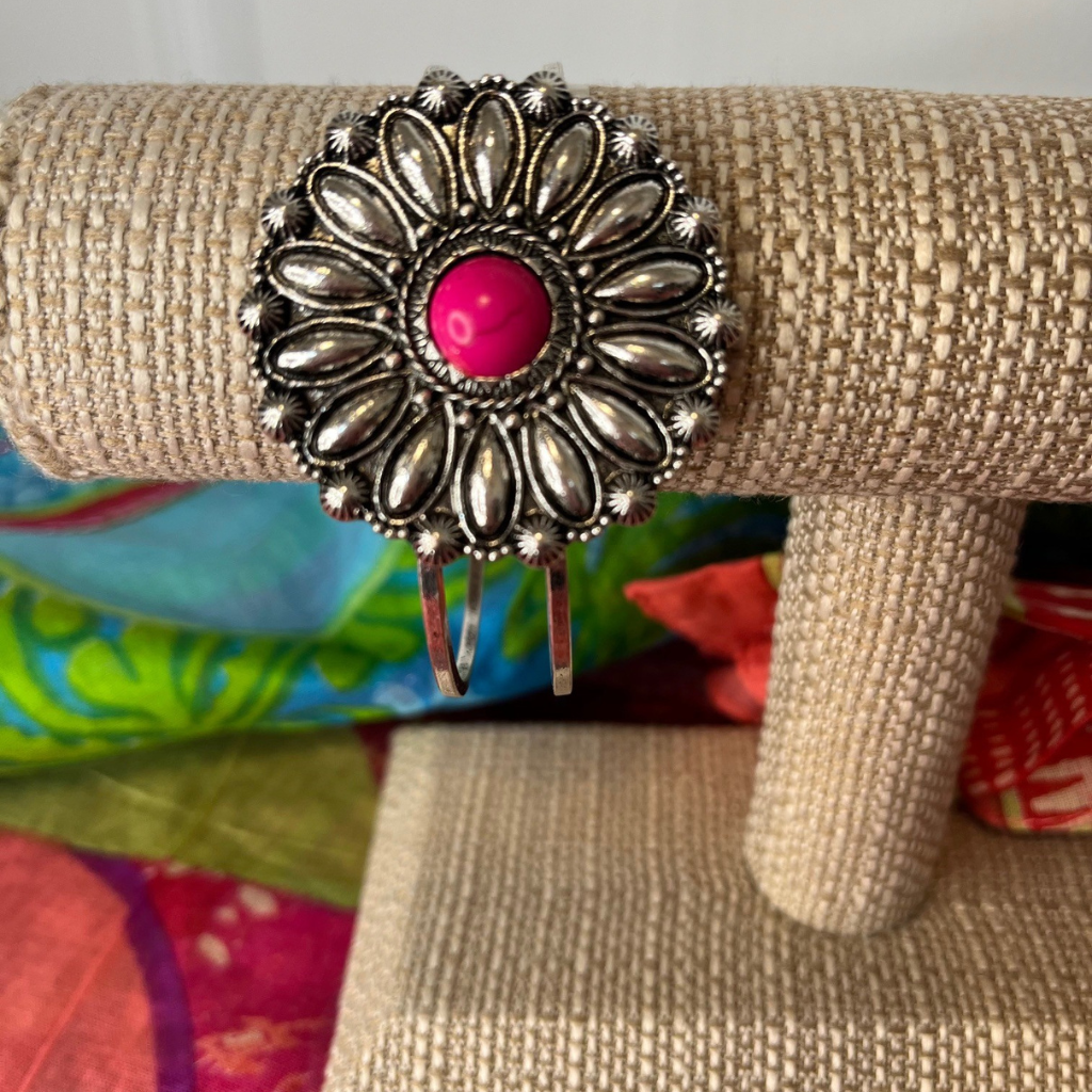 Navajo Boho Style Concho Bracelet - Fuchsia Stones in Burnished Silvertone Setting.  Shown on Bracelet Display on Top of a Sarong