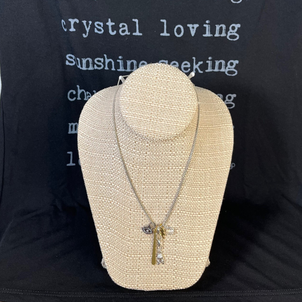 Rebel Multi Charm Edgy Necklace. Shown with "Lover of Light" Tee on Necklace Display