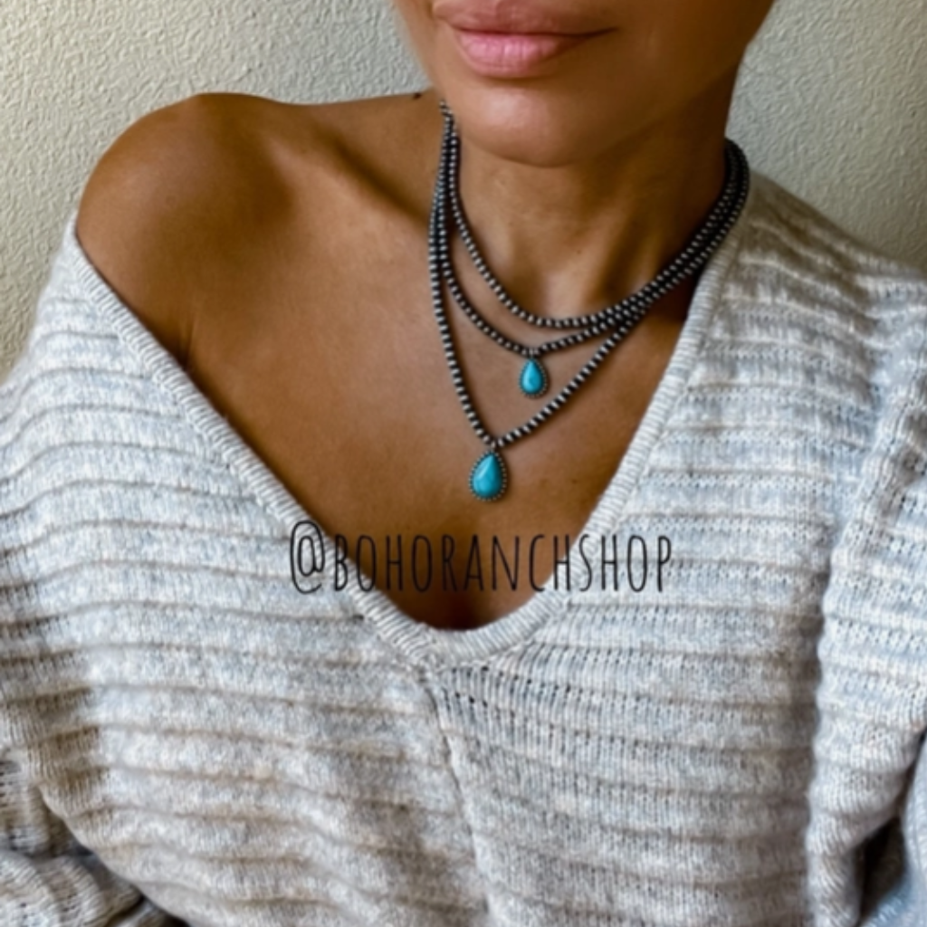 Multi Layered Teardrop Navajo Necklace - Turquoise Stones and Burnished Silver Beads.  Shown on Model