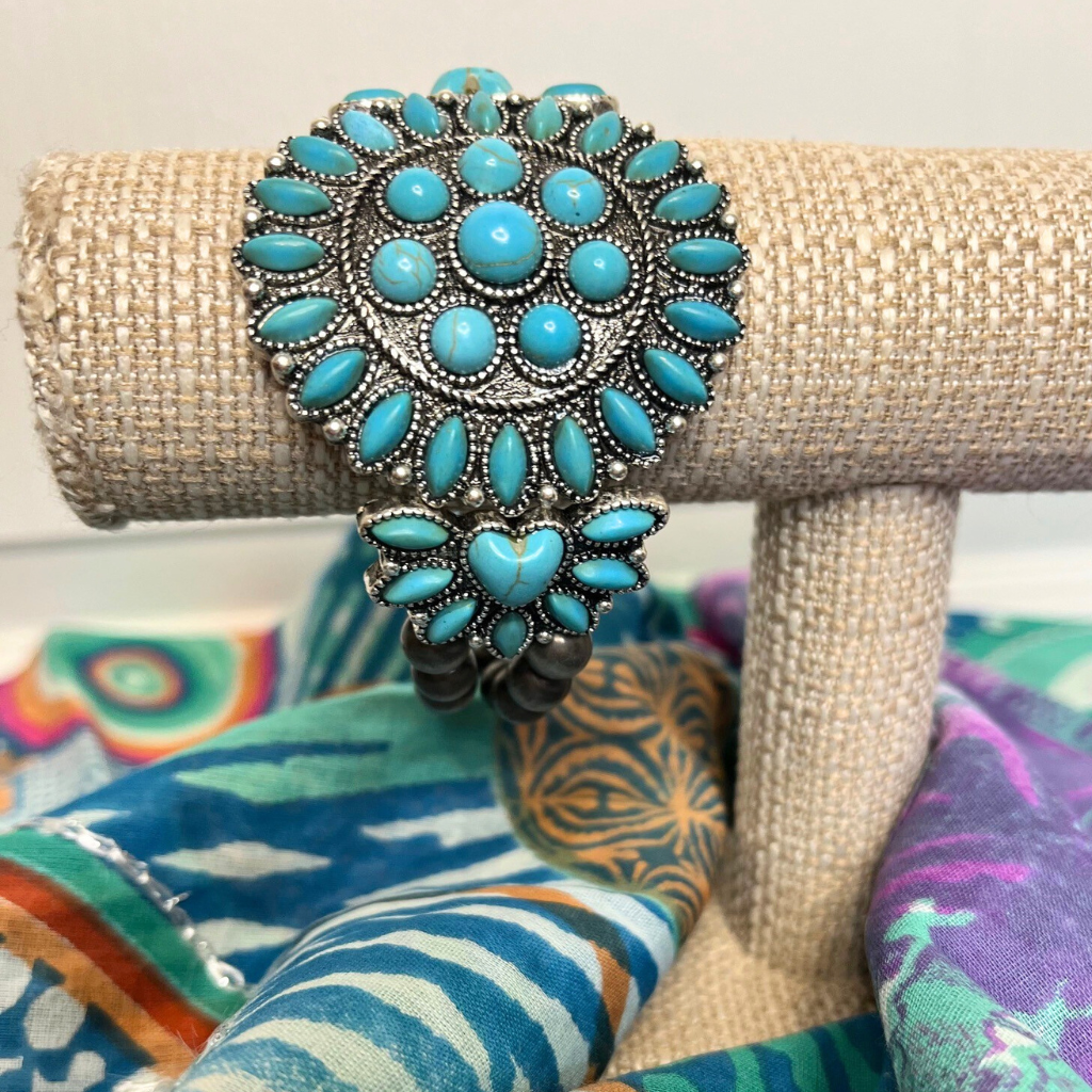 Western Boho Style Stretch Bracelet - Turquoise Stones with Burnished Silver Beads.  On Bracelet Display  Sitting on top of Sarong.